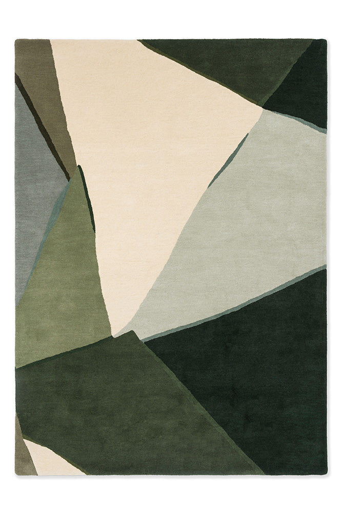 A handtufted Harlequin rug with abstract geometric shapes in a Fern/Pistachio colorway, featuring shades of green and beige.