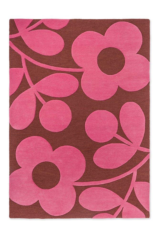 A rectangular Orla Kiely Sprig Stem Paprika rug with a floral pattern in pink and brown colors.
