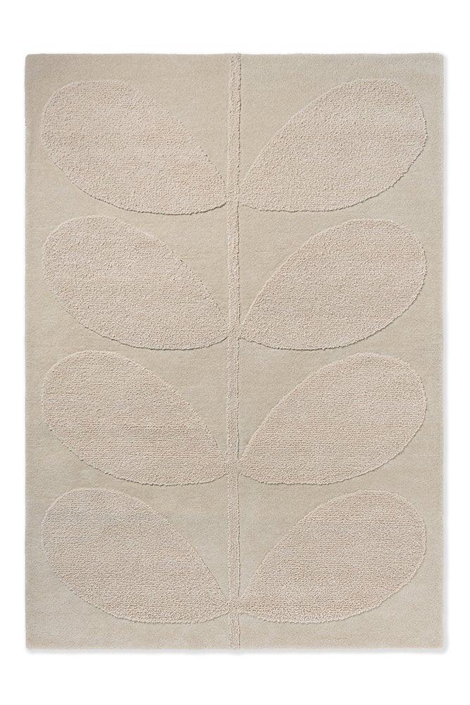 A beige Orla Kiely Solid Stem Fern rug with a floral motif and a subtle pink border.