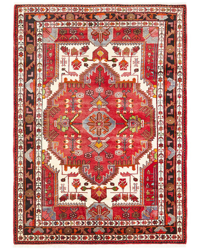 A traditional hand knotted pure wool Nahavand rug featuring a central medallion design with pale rust-red and beige patterns on a dark blue background.