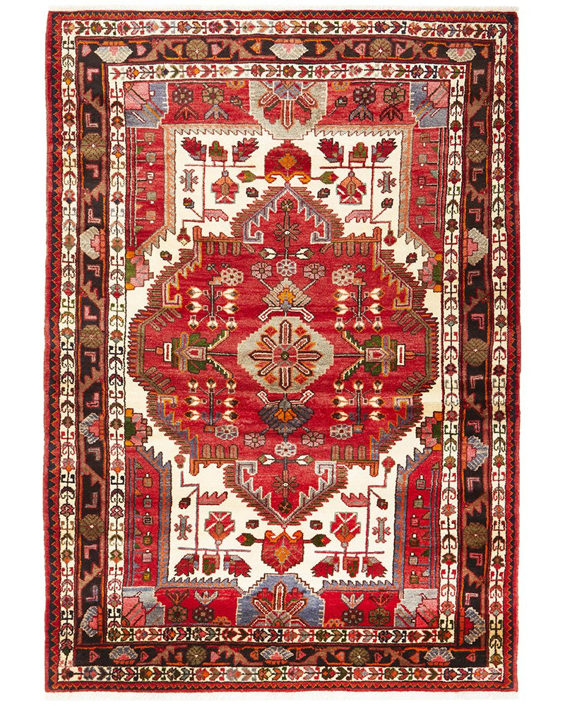 A traditional Nahavand wool rug with a central medallion design, featuring red, blue, and beige colors with geometric patterns.