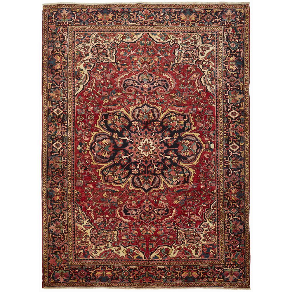 A Heriz hand knotted Persian rug with a geometric medallion design and ivory highlights, predominantly red and blue colors, made of high quality wool.
