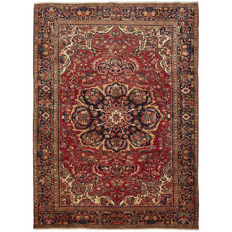 A Heriz hand knotted Persian rug with a geometric medallion design and ivory highlights, predominantly red and blue colors, made of high quality wool.