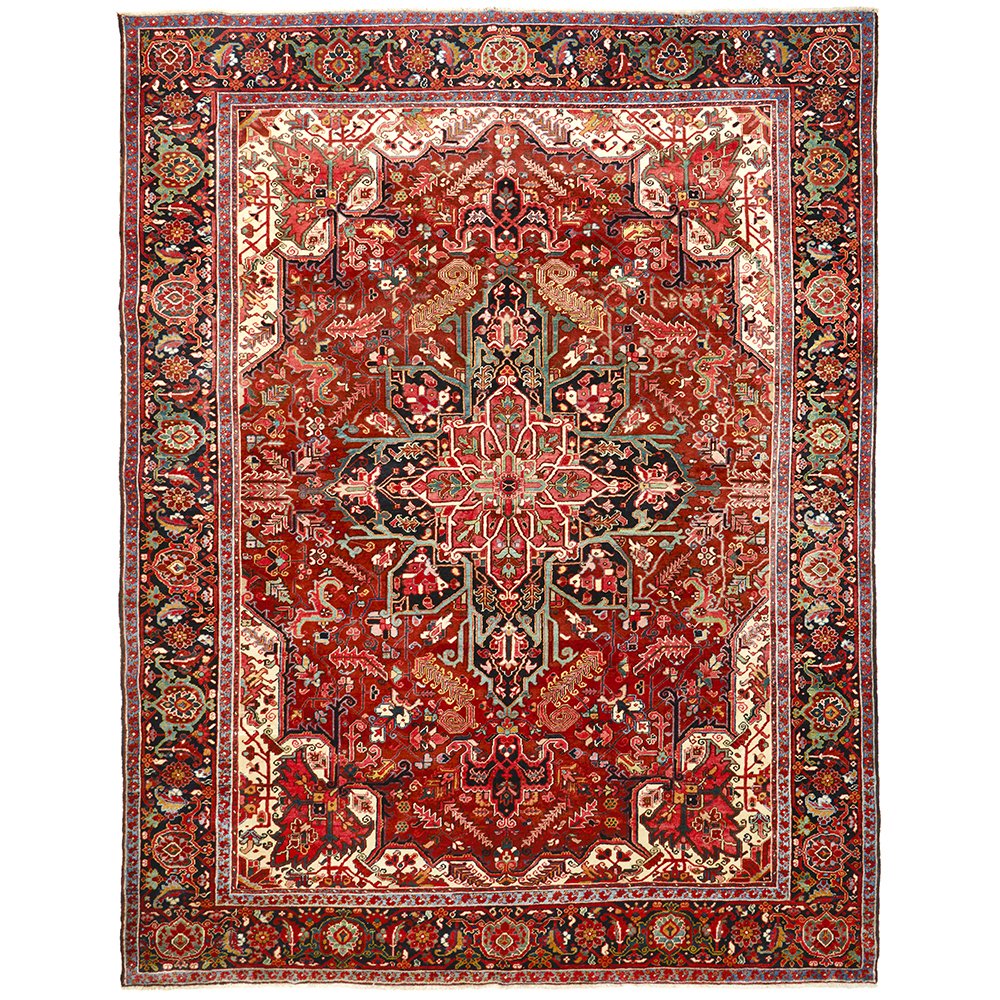 A large, hand knotted Persian rug with a geometric medallion design and ivory highlights, predominantly red and orange colors.