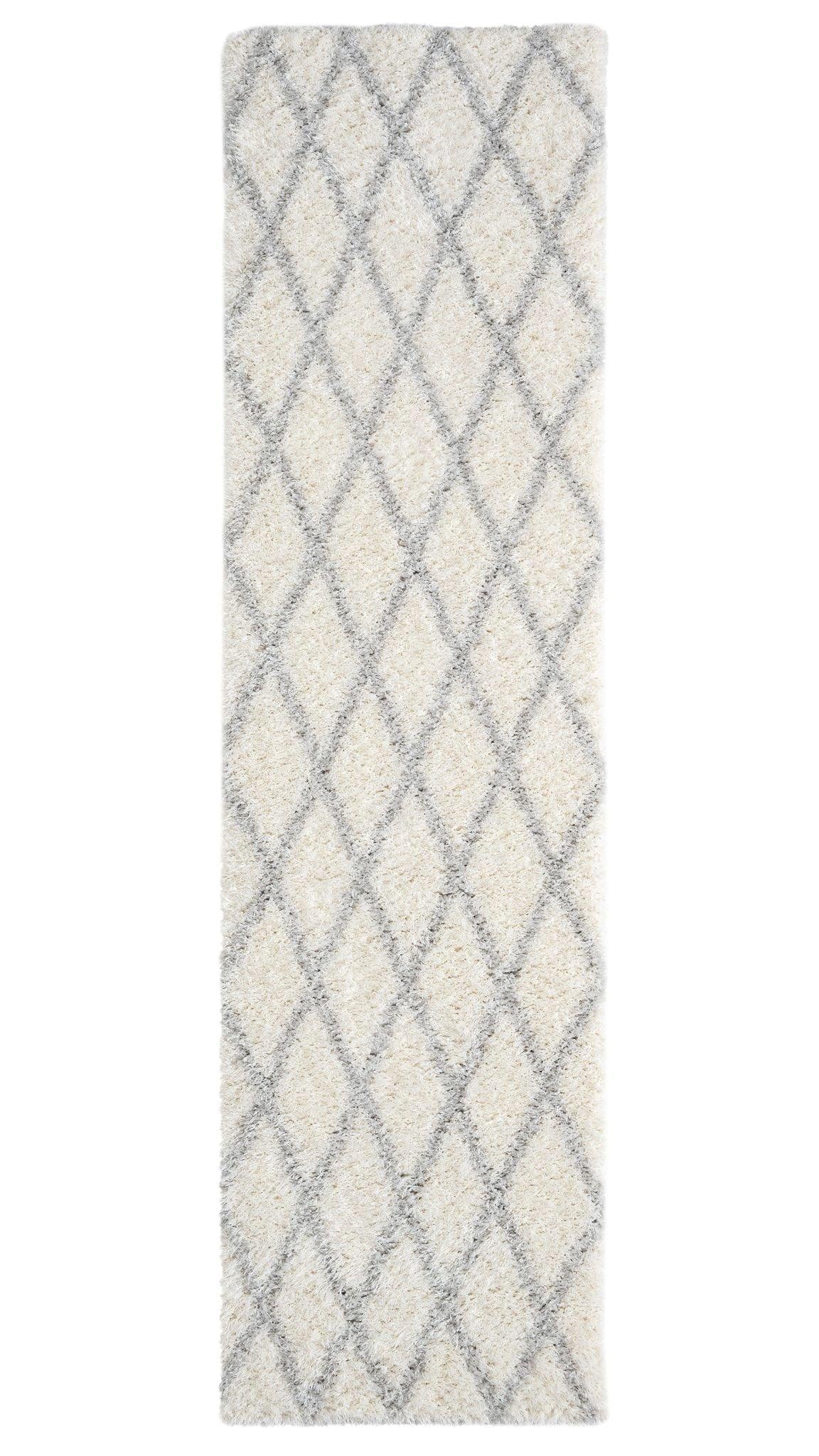 A shaggy area rug with a geometric diamond pattern in beige and gray colors, designed in a runner shape.
